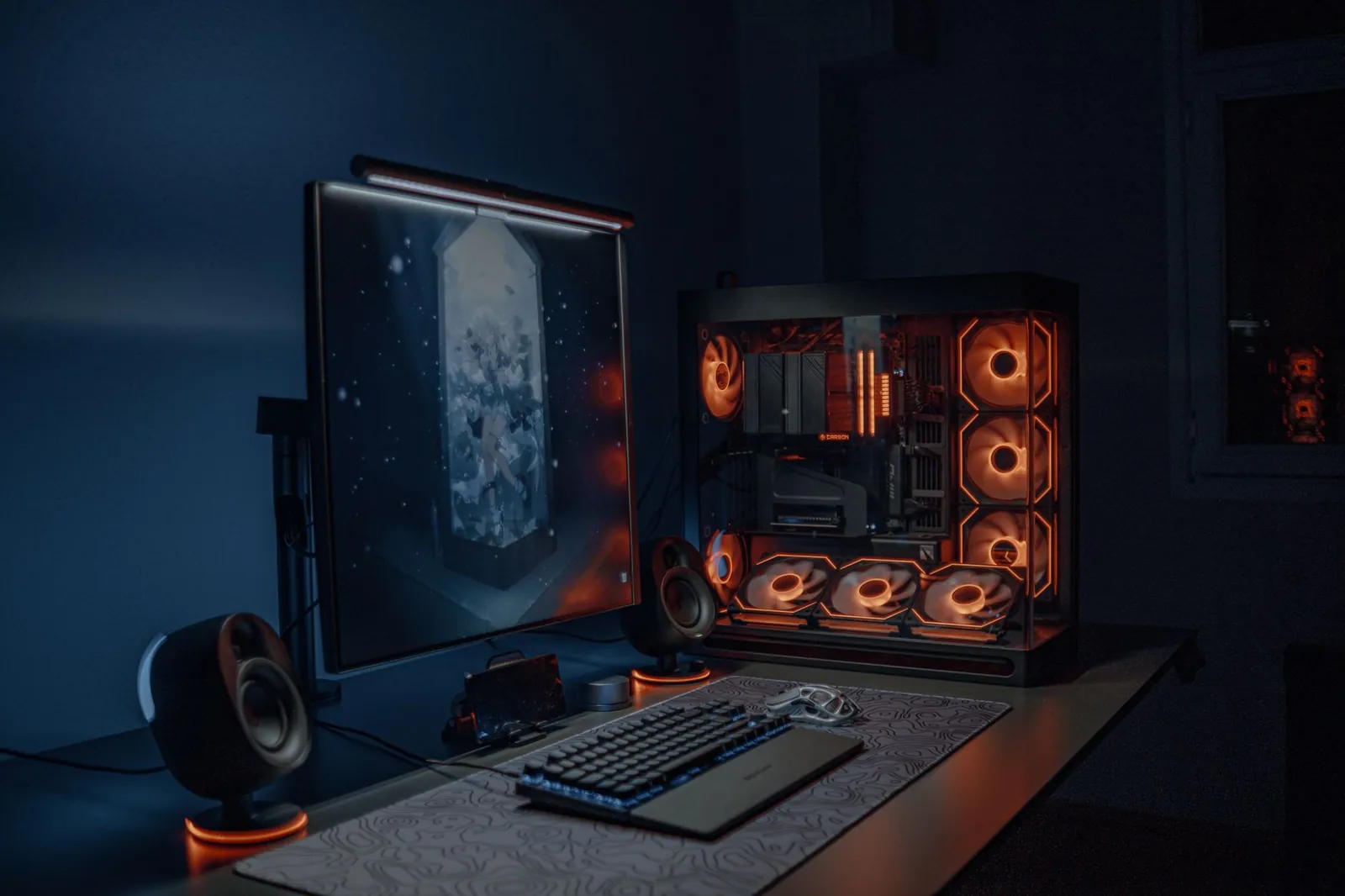 A streamer's neon-lit desk setup glowing with cyan and magenta RGB lighting